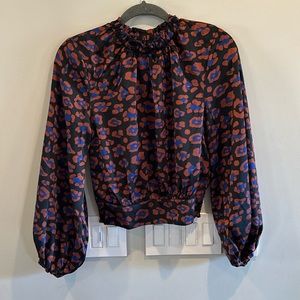 Boutique crop top with elastic on sleeves, neck and bottom back hem.